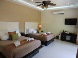 Cozy hotel room with two twin beds and modern amenities.